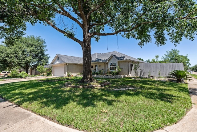 10302 Lybert Rd, Houston, TX 77041 - single story home with a front lawn, brick siding, an attached garage, and fence