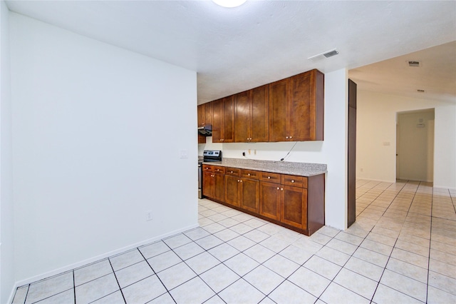 kitchen with range hood, stainless steel electric stove, light tile patterned floors, and visible vents