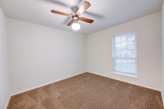 2215 Squire Dobbins Dr, Sugar Land, TX 77478 - spare room with dark carpet, baseboards, and ceiling fan