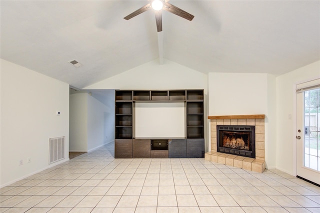unfurnished living room with light tile patterned floors, a fireplace, vaulted ceiling with beams, visible vents, and ceiling fan