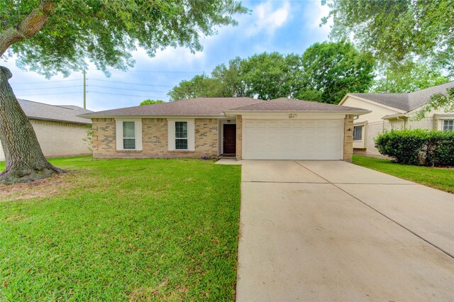 2215 Squire Dobbins Dr, Sugar Land, TX 77478 - ranch-style house featuring concrete driveway, an attached garage, a front lawn, and brick siding