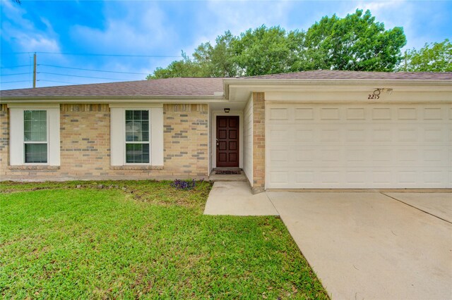 2215 Squire Dobbins Dr, Sugar Land, TX 77478 - single story home with an attached garage, roof with shingles, a front yard, brick siding, and driveway