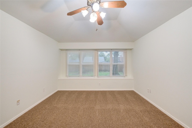 unfurnished room featuring lofted ceiling, carpet flooring, ceiling fan, and baseboards
