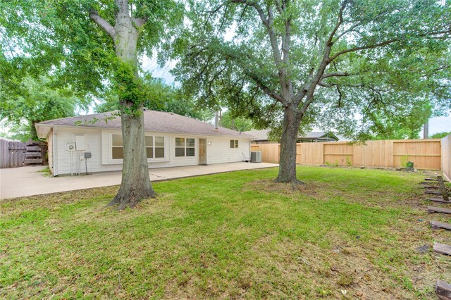 2215 Squire Dobbins Dr, Sugar Land, TX 77478 - rear view of property featuring a patio area and central AC unit