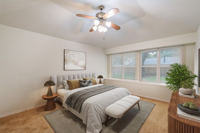 2215 Squire Dobbins Dr, Sugar Land, TX 77478 - carpeted bedroom featuring baseboards and a ceiling fan