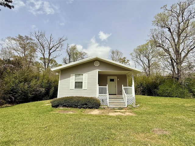 602 E Main St, Kirbyville, TX 75956 - bungalow-style home with a porch and a front lawn
