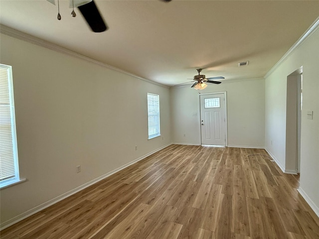 602 E Main St, Kirbyville, TX 75956 - interior space with a ceiling fan, ornamental molding, light wood finished floors, and baseboards