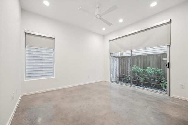 empty room featuring concrete floors, baseboards, a ceiling fan, and recessed lighting