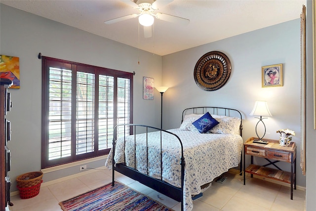 12934 Bristol Berry Dr, Cypress, TX 77429 - tiled bedroom with multiple windows, baseboards, and ceiling fan