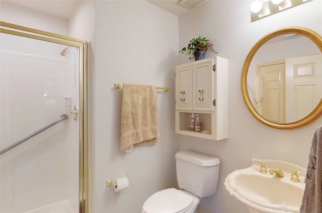 12934 Bristol Berry Dr, Cypress, TX 77429 - bathroom featuring a stall shower, toilet, and a sink