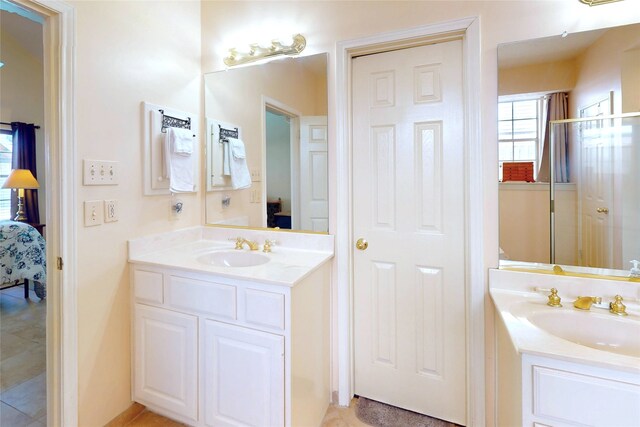 12934 Bristol Berry Dr, Cypress, TX 77429 - ensuite bathroom featuring two vanities and tile patterned floors
