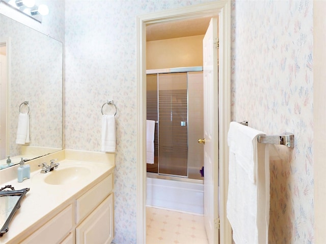 12934 Bristol Berry Dr, Cypress, TX 77429 - full bath featuring wallpapered walls, vanity, enclosed tub / shower combo, and tile patterned floors