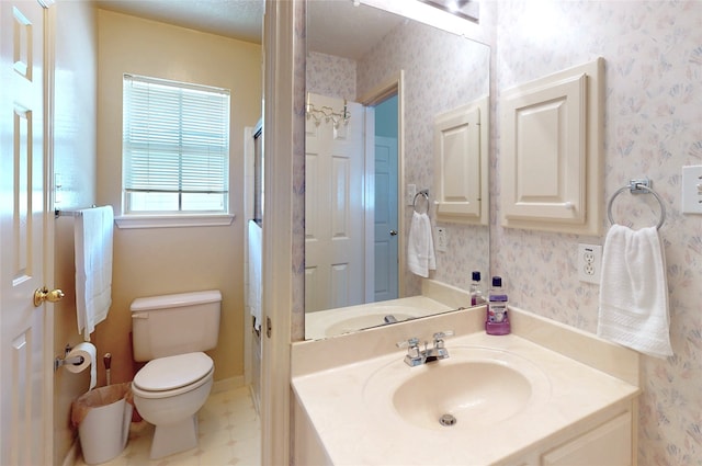 12934 Bristol Berry Dr, Cypress, TX 77429 - full bathroom featuring wallpapered walls, toilet, vanity, and a shower with door