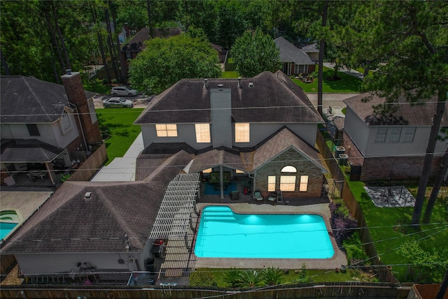 12934 Bristol Berry Dr, Cypress, TX 77429 - rear view of house featuring a fenced backyard, a patio, a chimney, and a shingled roof