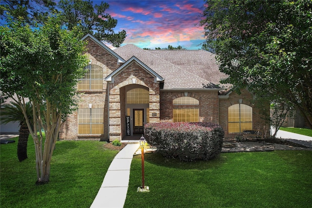 12934 Bristol Berry Dr, Cypress, TX 77429 - view of front of house featuring brick siding, a shingled roof, and a front lawn
