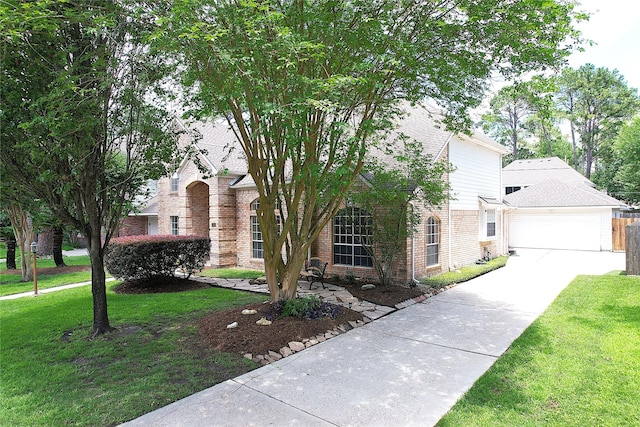 12934 Bristol Berry Dr, Cypress, TX 77429 - view of front of property featuring brick siding, a front lawn, driveway, and an attached garage