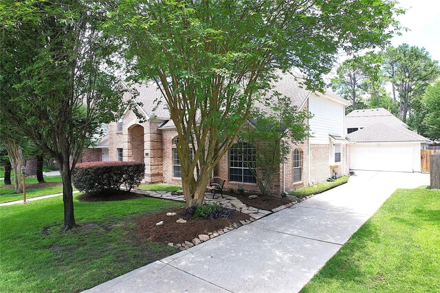 12934 Bristol Berry Dr, Cypress, TX 77429 - view of front of property featuring brick siding, a front yard, driveway, and a garage