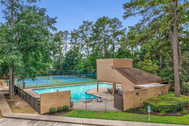 12934 Bristol Berry Dr, Cypress, TX 77429 - community pool featuring a tennis court and a patio