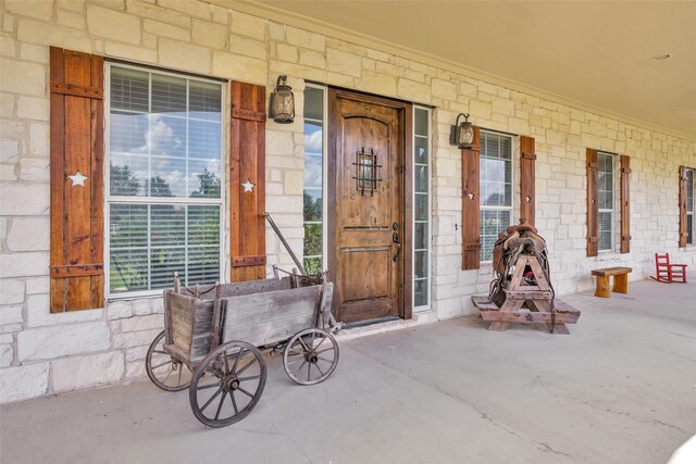 1650 Winding Canyon Ct, Katy, TX 77493 - entrance to property with covered porch and stone siding