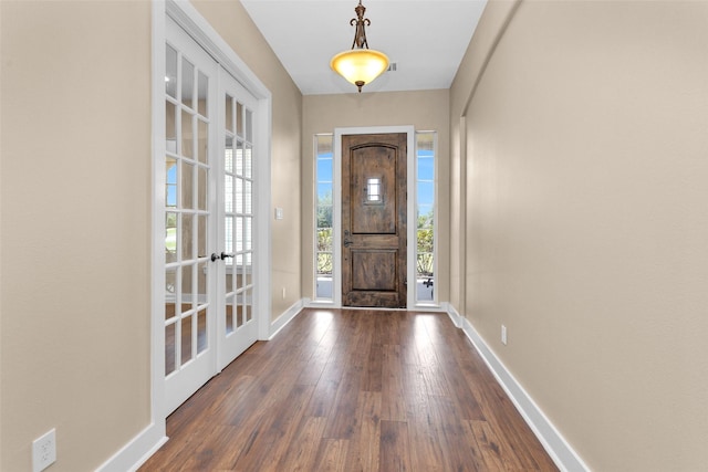 1650 Winding Canyon Ct, Katy, TX 77493 - foyer entrance with french doors, baseboards, and dark wood-style floors