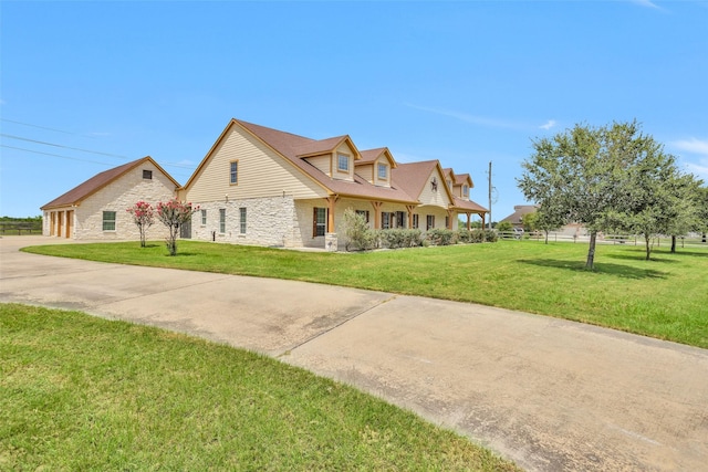 1650 Winding Canyon Ct, Katy, TX 77493 - view of front of home with stone siding, a front lawn, and a garage
