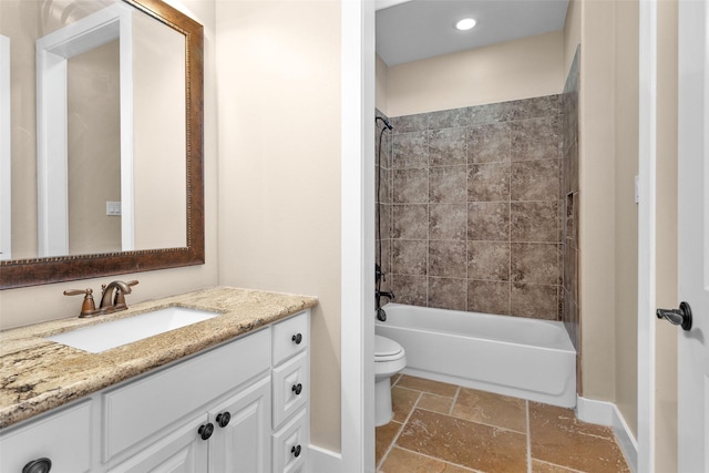 1650 Winding Canyon Ct, Katy, TX 77493 - full bath with toilet, stone tile floors, baseboards, vanity, and shower / bathtub combination