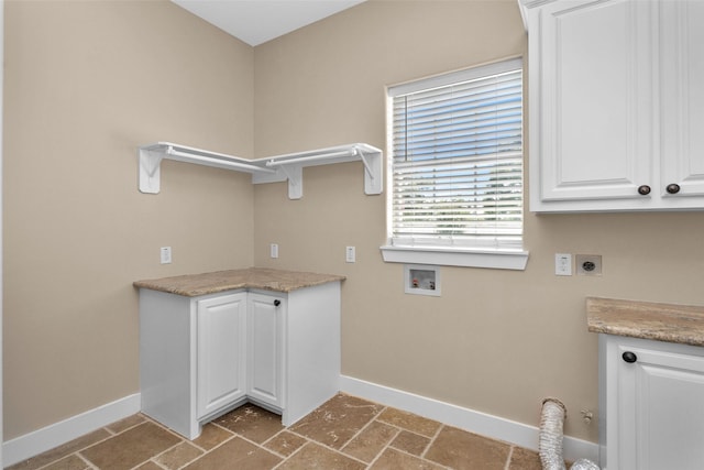 1650 Winding Canyon Ct, Katy, TX 77493 - laundry room with cabinet space, washer hookup, baseboards, and electric dryer hookup