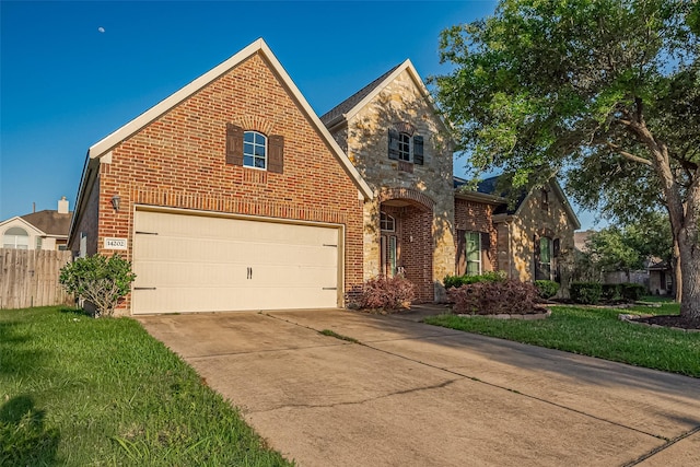traditional-style home featuring fence, a garage, brick siding, and concrete driveway