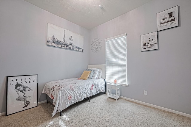 bedroom featuring baseboards and carpet floors