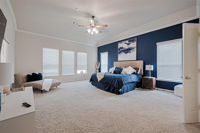 carpeted bedroom featuring visible vents, baseboards, a ceiling fan, and ornamental molding