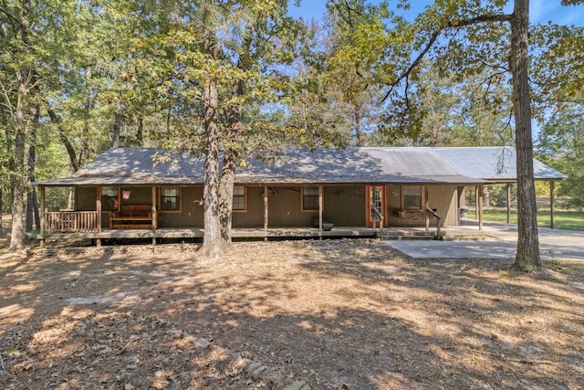 2540 Howell Rd, Corrigan, TX 75939 - view of front of home featuring covered porch and an attached carport