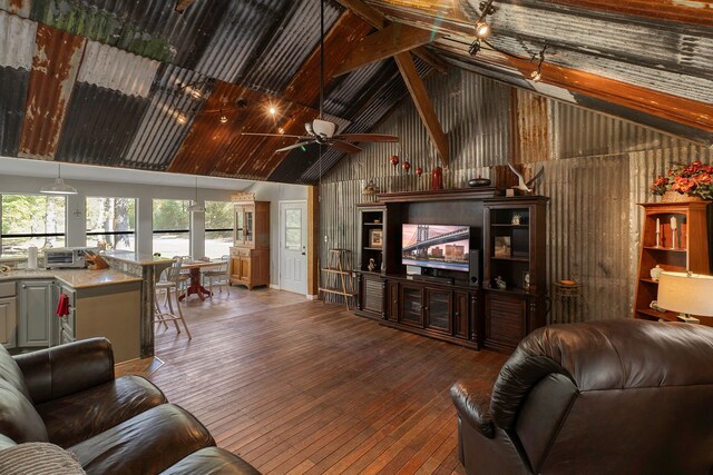 2540 Howell Rd, Corrigan, TX 75939 - living room with hardwood / wood-style flooring, wood walls, high vaulted ceiling, a toaster, and a ceiling fan
