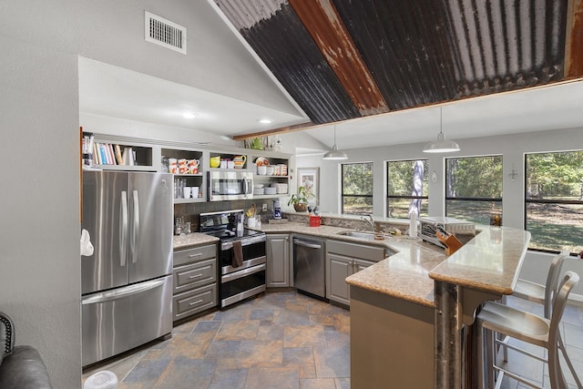 2540 Howell Rd, Corrigan, TX 75939 - kitchen featuring stainless steel appliances, gray cabinetry, stone finish floor, and visible vents