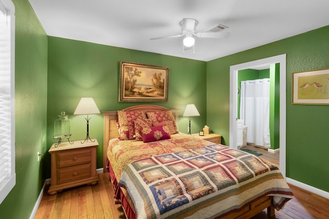2540 Howell Rd, Corrigan, TX 75939 - bedroom featuring baseboards, visible vents, and hardwood / wood-style flooring