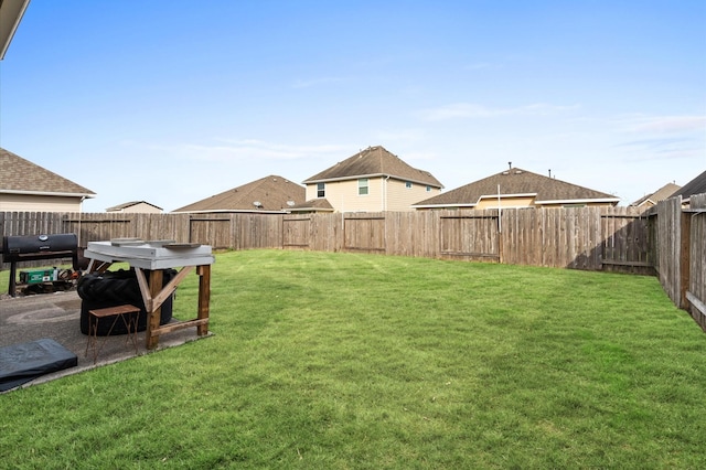 view of yard featuring a fenced backyard