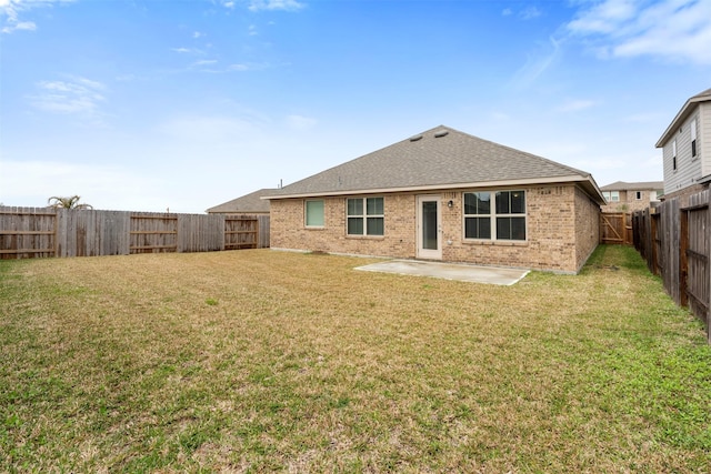 13714 Seneca Lake Dr, Texas City, TX 77568 - rear view of property with brick siding, a patio, a fenced backyard, a lawn, and a shingled roof