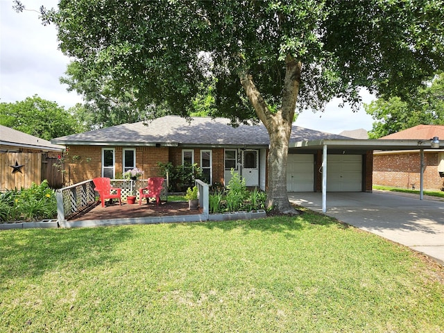 ranch-style house featuring a garage, fence, a front lawn, brick siding, and driveway