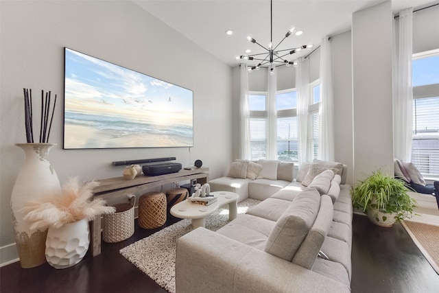 living room featuring a chandelier, wood finished floors, and recessed lighting