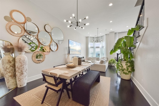 dining space featuring an inviting chandelier, wood finished floors, baseboards, and recessed lighting