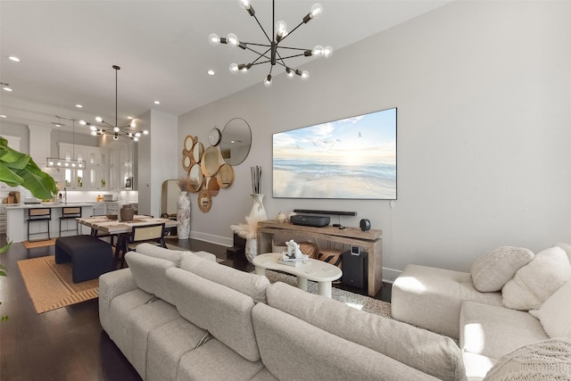 living room with baseboards, a notable chandelier, dark wood finished floors, and recessed lighting