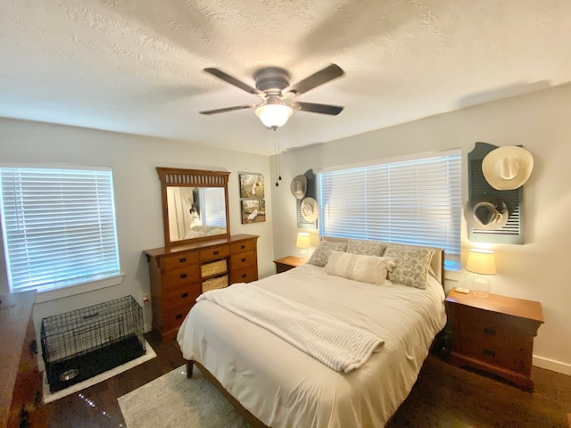 685 W 4th St, Groveton, TX 75845 - bedroom with baseboards, a ceiling fan, and wood finished floors