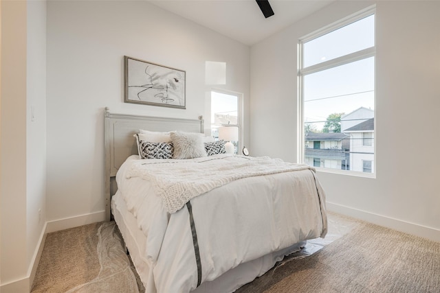 411 W Drew St, Houston, TX 77006 - bedroom with light carpet, baseboards, lofted ceiling, and ceiling fan