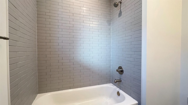 411 W Drew St, Houston, TX 77006 - bathroom featuring tub / shower combination