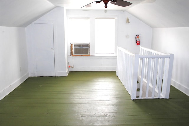 508 Texas St, Brenham, TX 77833 - additional living space featuring baseboards, cooling unit, ceiling fan, wood-type flooring, and vaulted ceiling