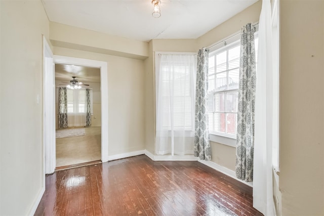 508 Texas St, Brenham, TX 77833 - spare room featuring hardwood / wood-style flooring, baseboards, and plenty of natural light