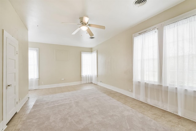 508 Texas St, Brenham, TX 77833 - spare room featuring plenty of natural light, visible vents, a ceiling fan, and light carpet