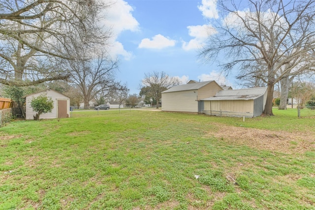 508 Texas St, Brenham, TX 77833 - view of yard featuring an outbuilding, fence, and a shed