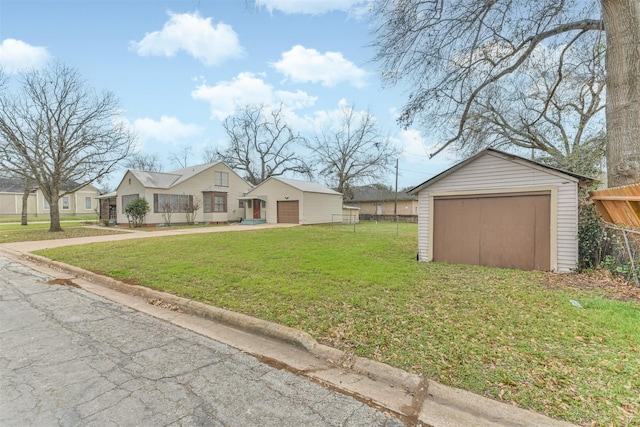 508 Texas St, Brenham, TX 77833 - view of yard featuring driveway, an outdoor structure, a garage, and fence