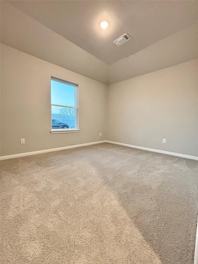 1105 W Bayshore Dr, Palacios, TX 77465 - unfurnished room featuring baseboards, visible vents, and carpet