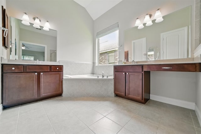 2106 Wild Peregrine Cir, Katy, TX 77494 - full bathroom with a garden tub, tile patterned floors, two vanities, lofted ceiling, and a ceiling fan